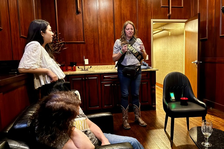 a man and a woman sitting on a chair