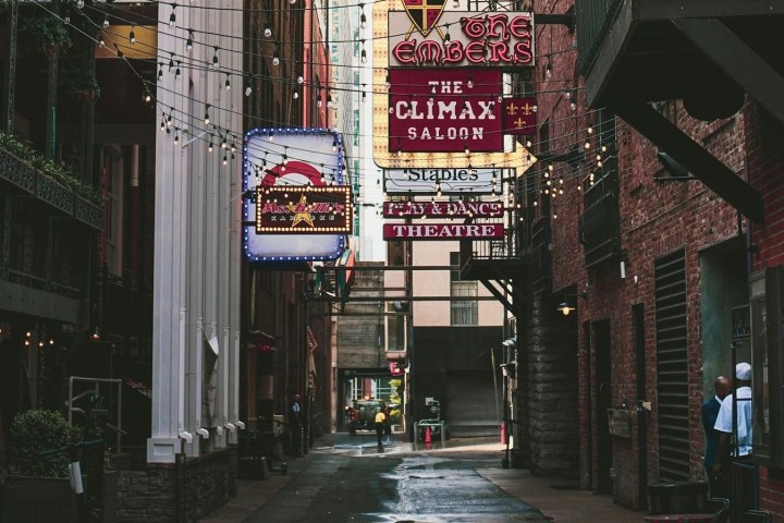 a sign above a store in a city