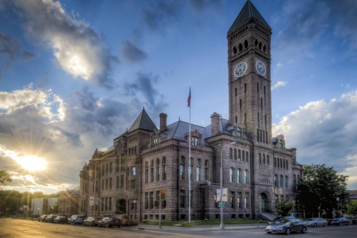 a large clock tower towering over a city