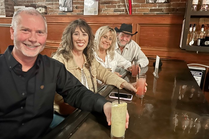 a group of people drinking at nashville fedora lounge