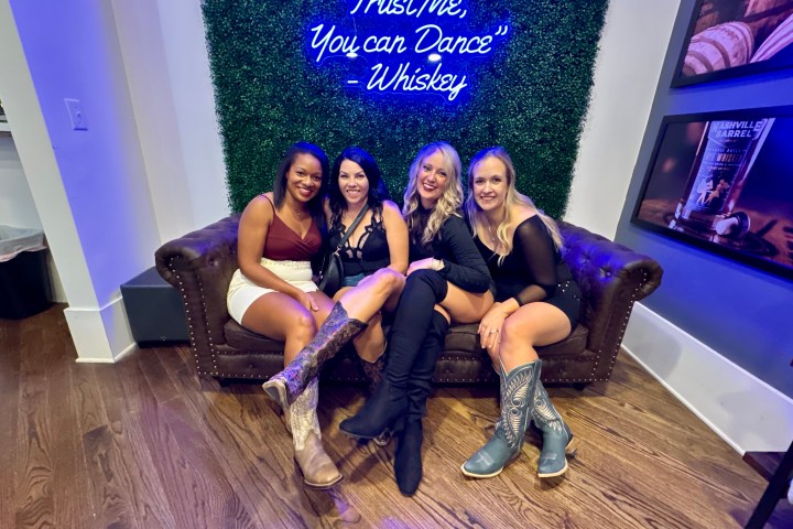 a group of girls sitting with whiskey