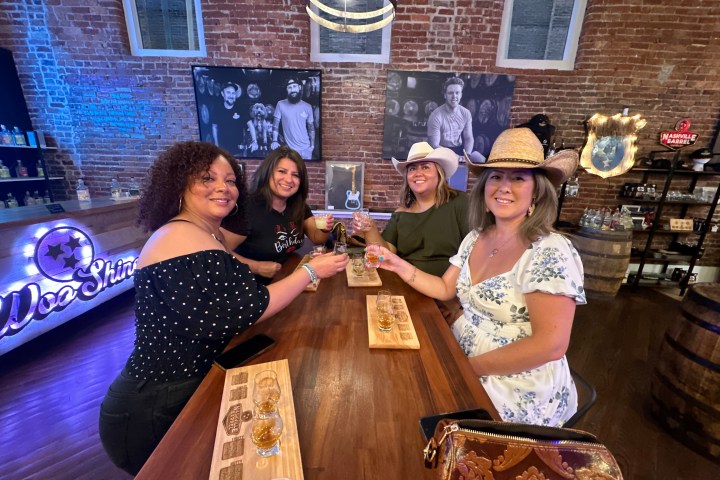 a person sitting at a table in front of a building