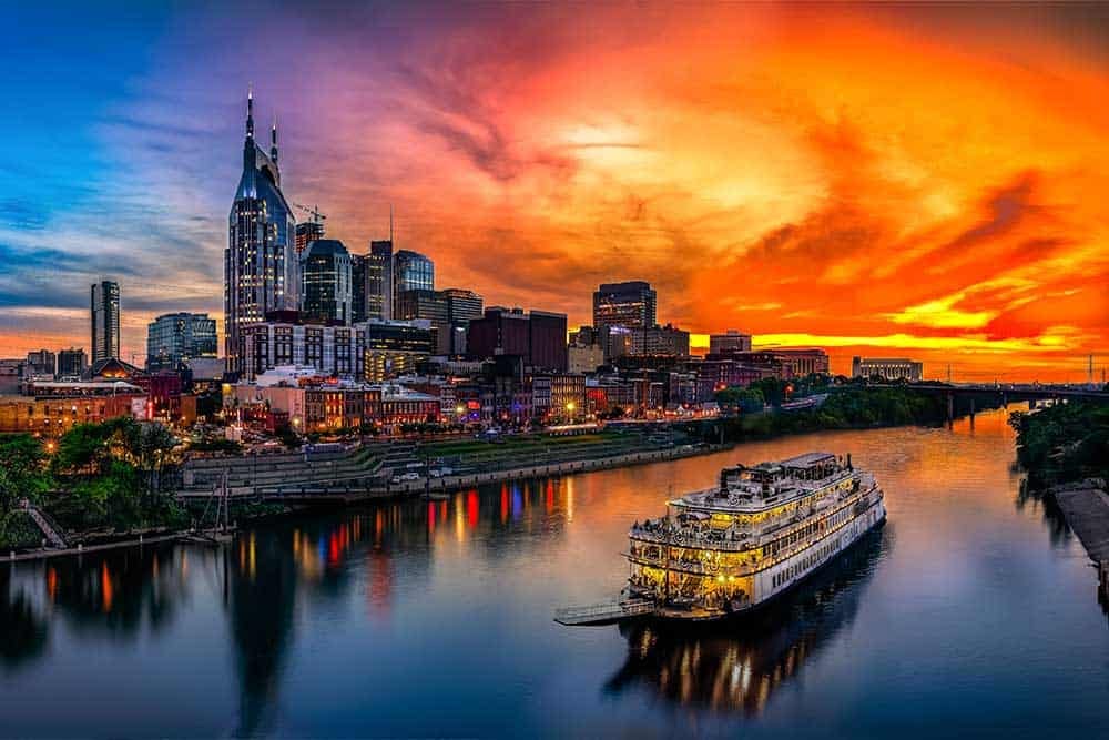cumberland river nashville tennessee downtown a long bridge over a body of water with a city in the background