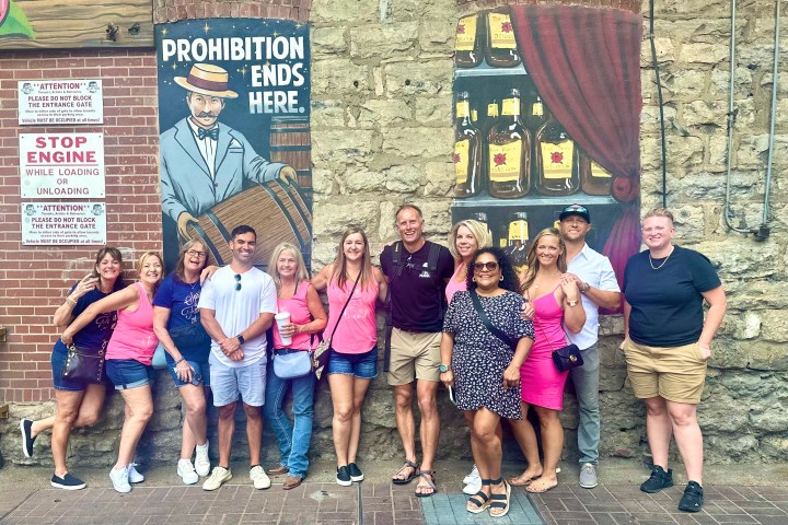 a group of people standing in front of a building