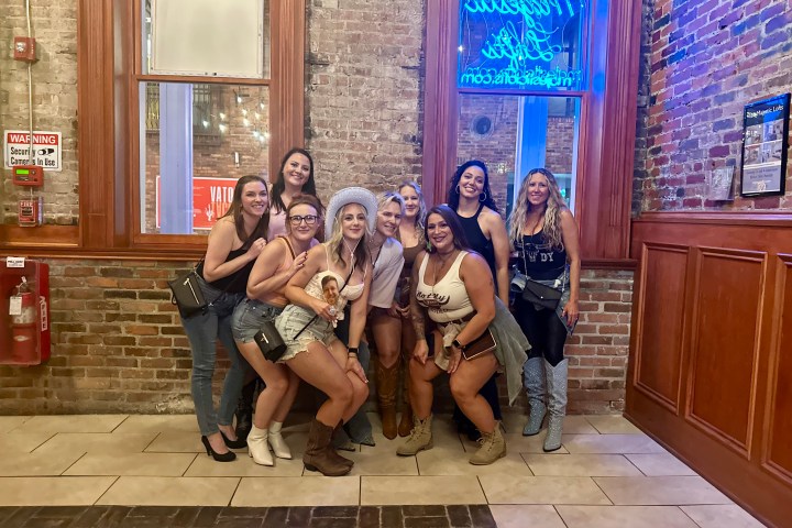 bachelorettes cheersing on speakeasy tour