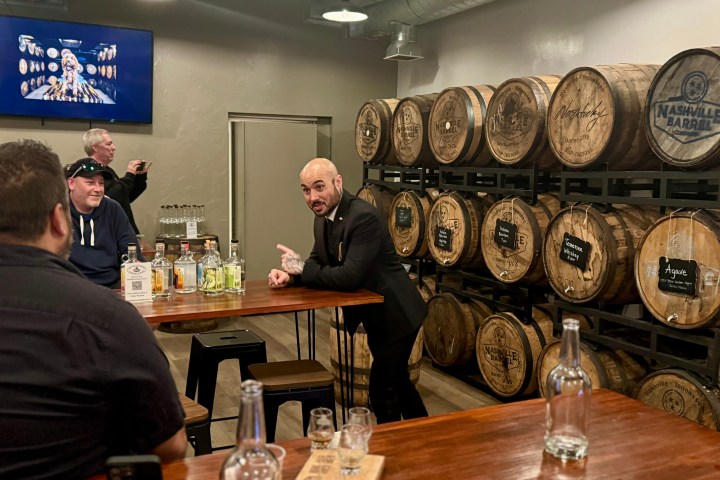 a group of people sitting at a table with wine glasses