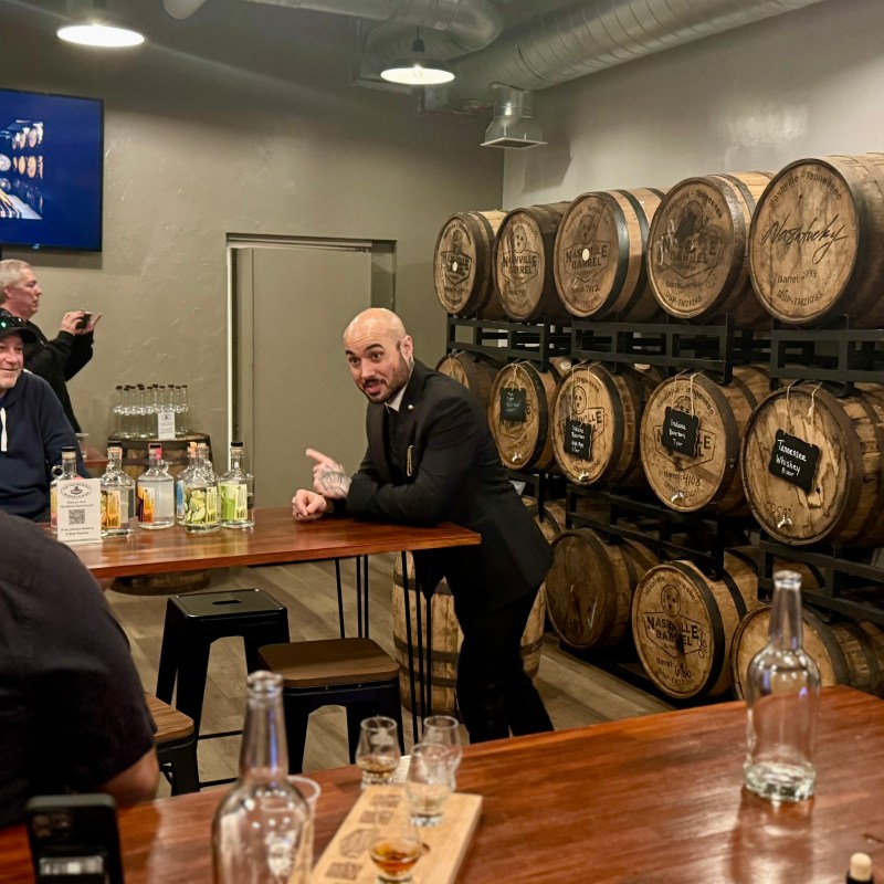 a group of people sitting at a table with wine glasses