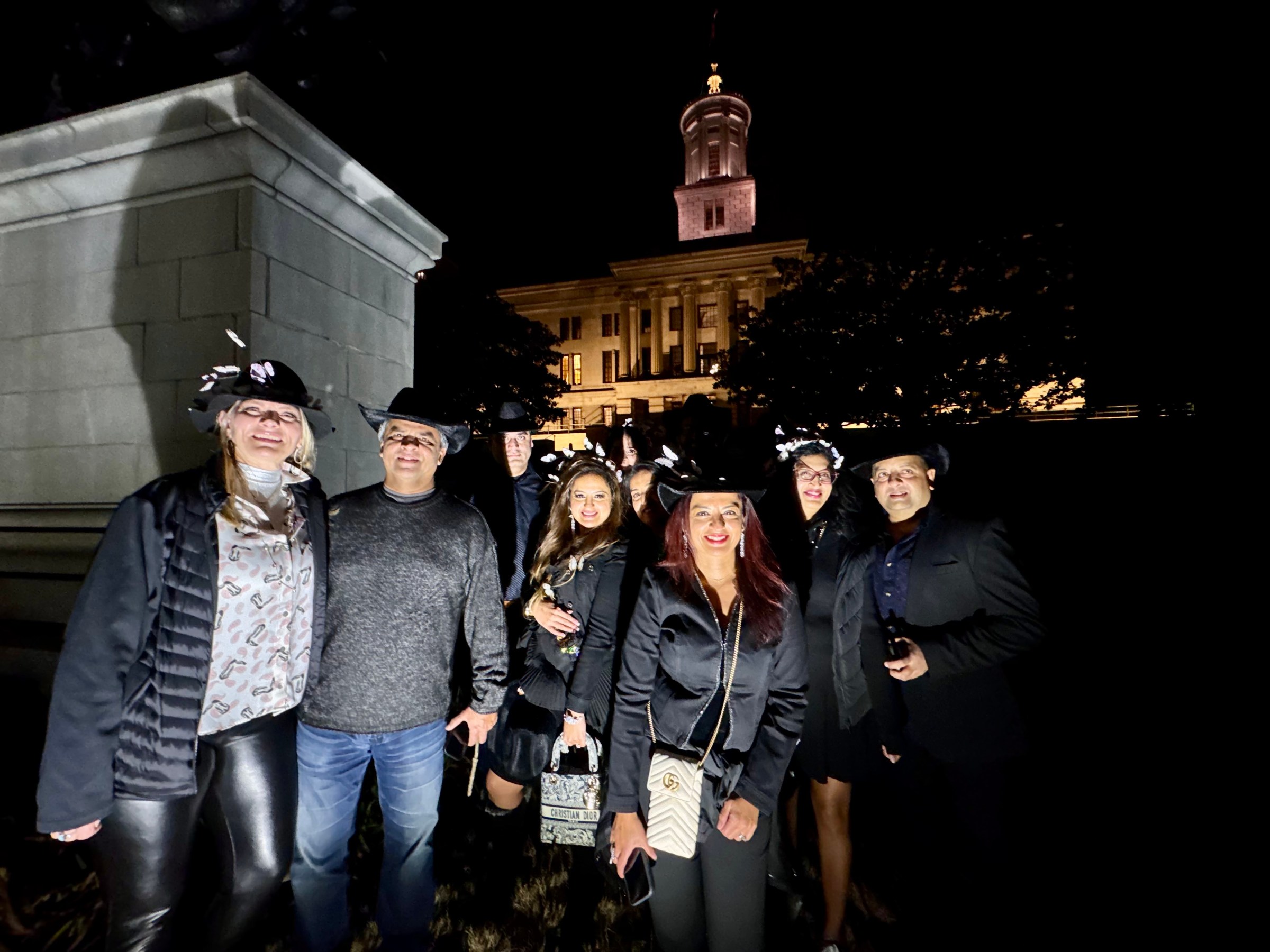 a group of people standing in front of a building