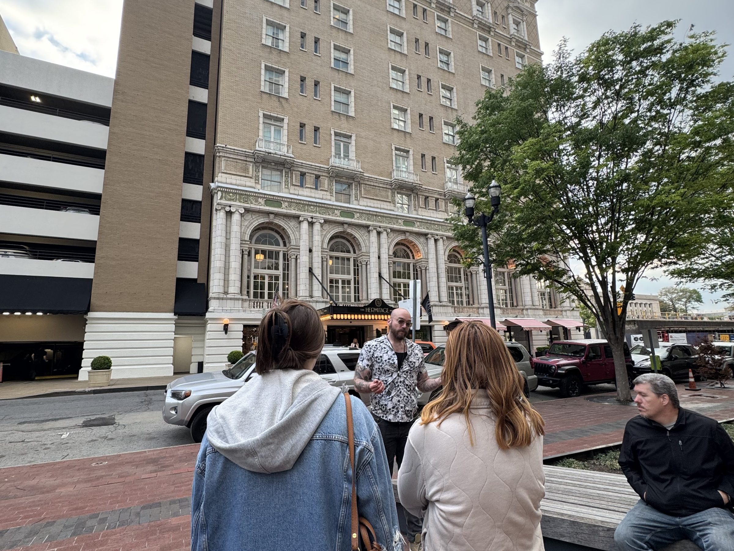 a group of people standing in front of a building