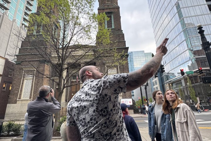 a group of people standing in front of a building