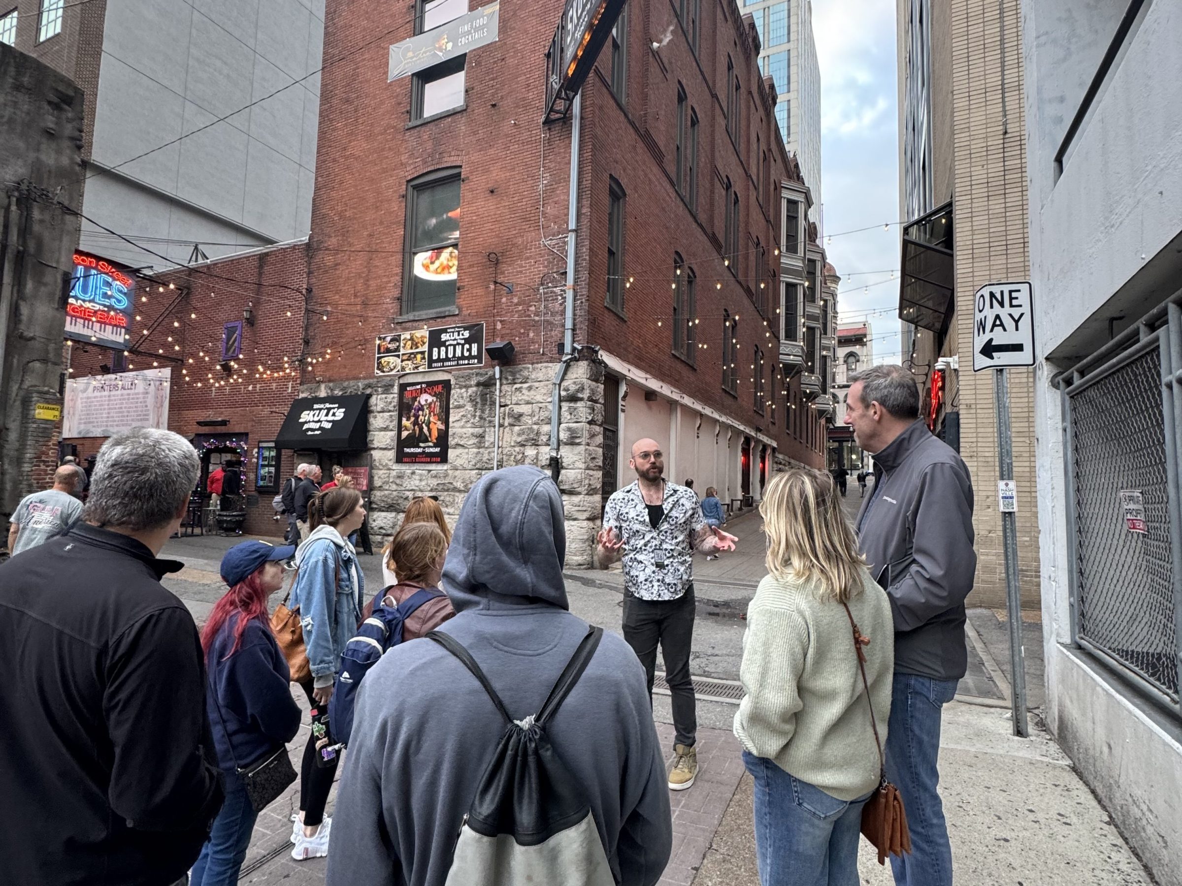 a group of people walking down the street