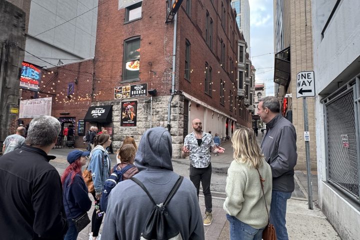 a group of people walking down the street