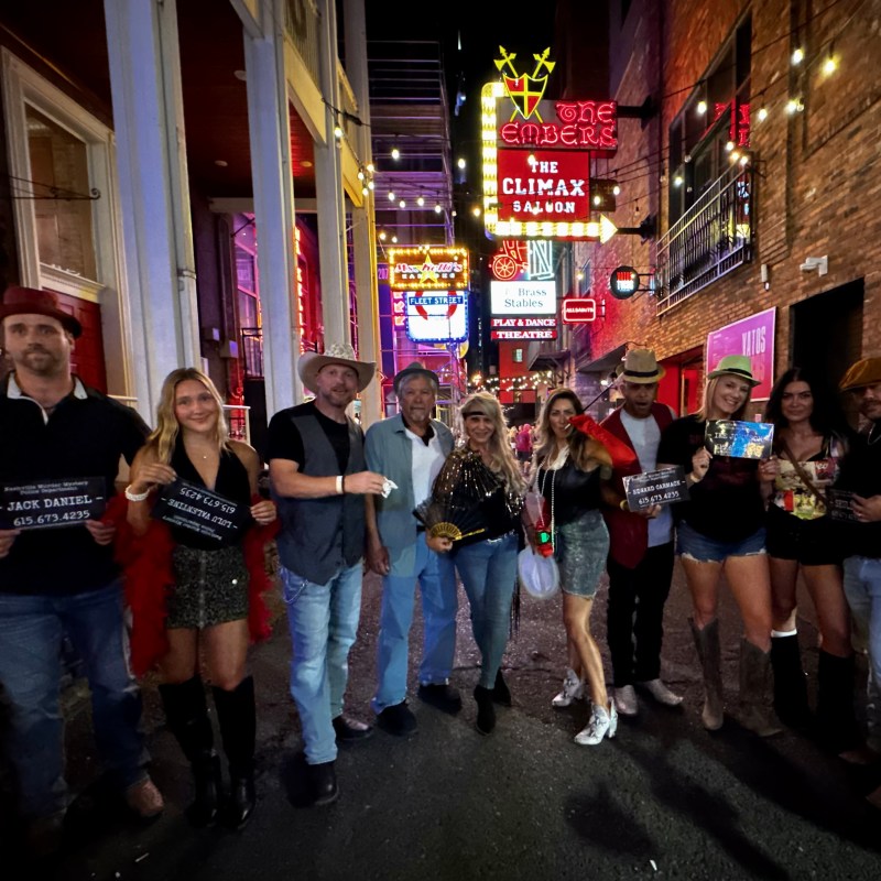 a group of people standing in front of a crowd