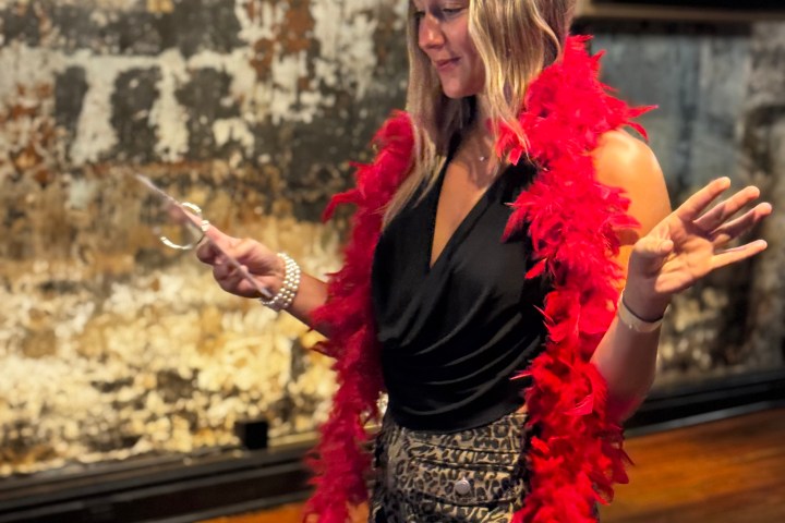 a woman standing in front of a building