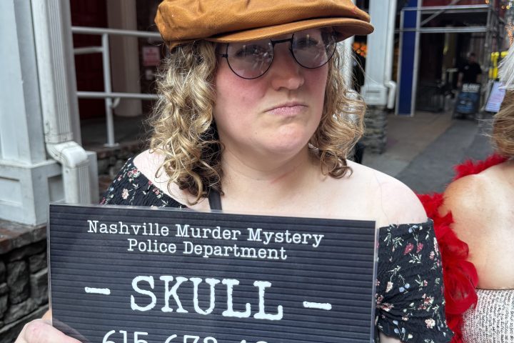 a woman holding a sign